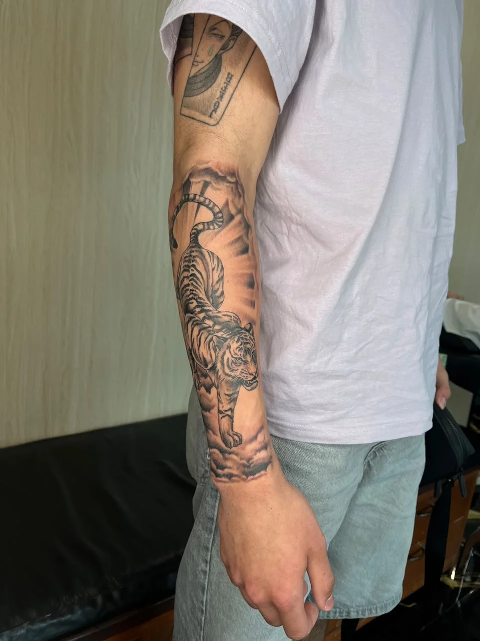 man hand tiger animal shading wave cloud black work japanese tattoo canggu bali
