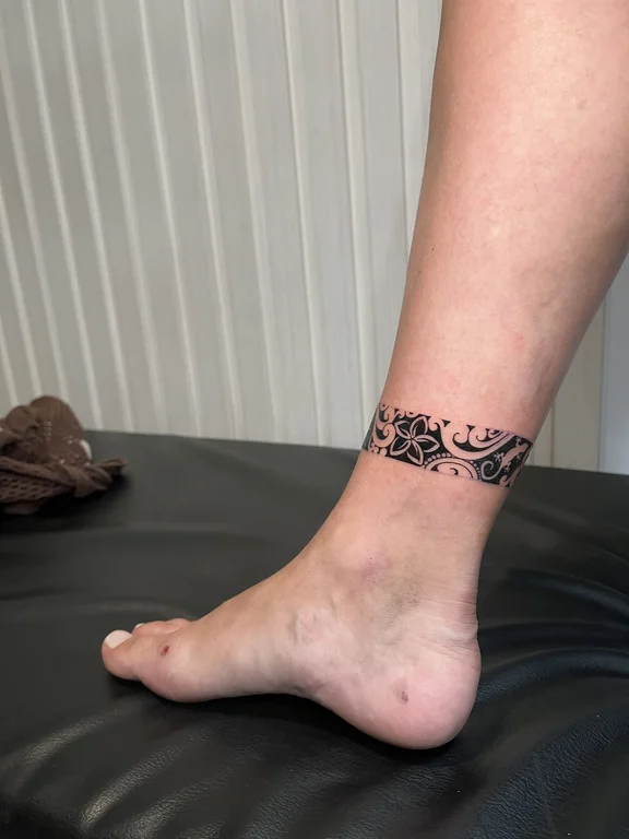 floral blackwork lotus linework elegant fine line black grey soft shading tattoo Canggu Bali