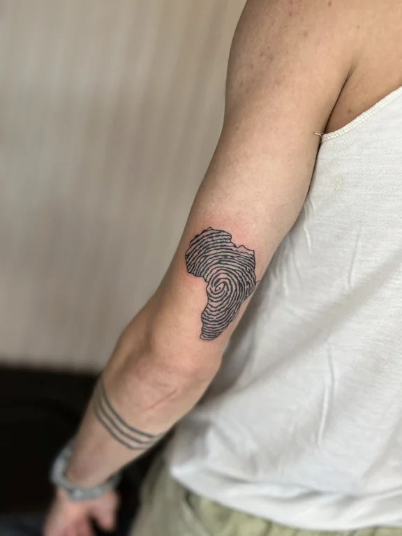 abstract blackwork man dotwork minimal linework black grey soft shading tattoo Canggu Bali