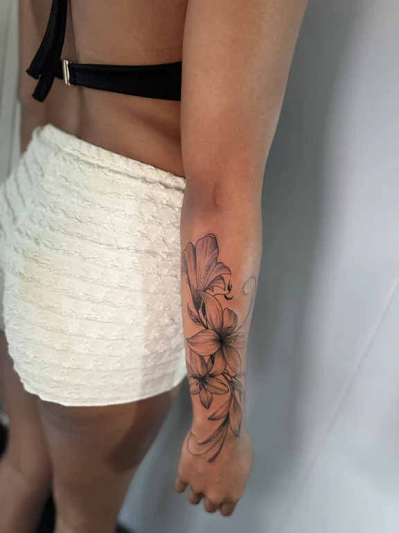 floral blackwork peony soft shading elegant linework black grey fine line tattoo Canggu Bali