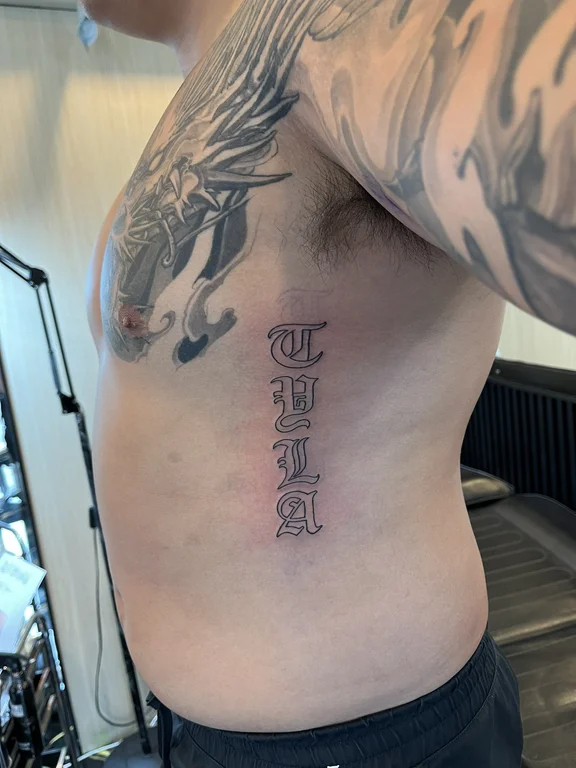 lettering blackwork man linework cloud bold line dotwork black grey tattoo Canggu Bali