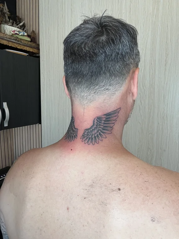 symbol blackwork phoenix black grey elegant fine line man angel tattoo Canggu Bali