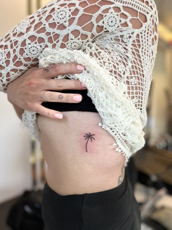 symbol blackwork woman fine line elegant minimal thin line bold line tattoo Canggu Bali