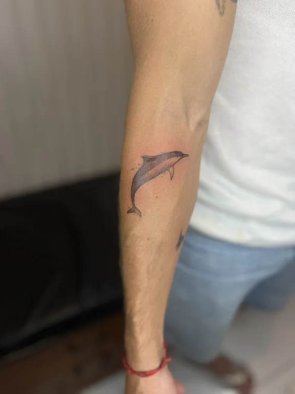 abstract minimalist man fine line wave soft shading minimal bold line tattoo Canggu Bali