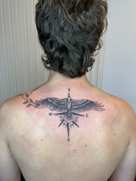 symbol dotwork phoenix linework elegant black grey soft shading angel tattoo Canggu Bali