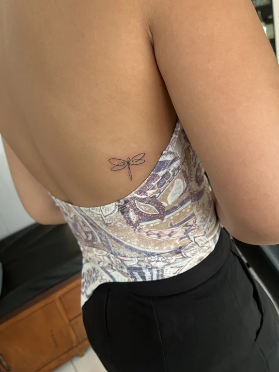 abstract fine line butterfly linework elegant minimal soft shading spiritual tattoo Canggu Bali