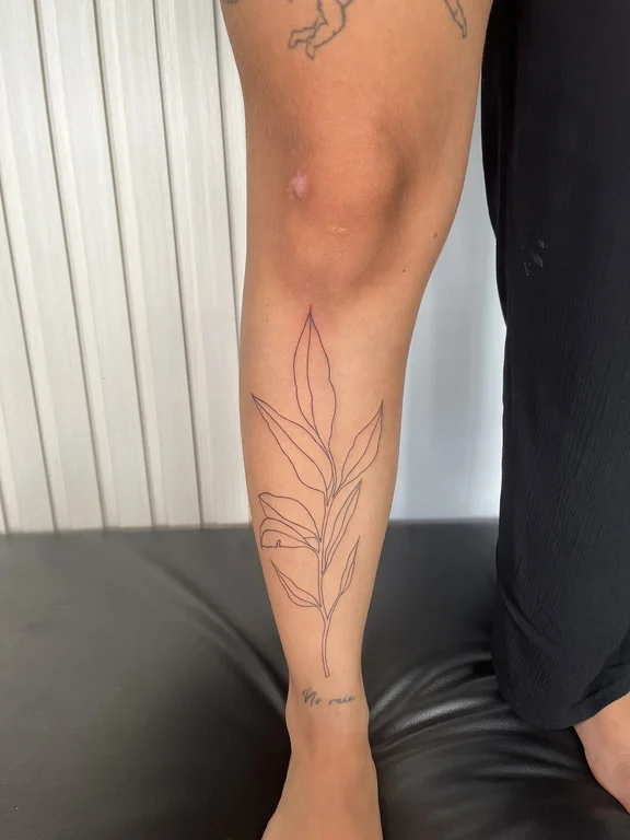 abstract fine line lotus linework elegant bold line minimal leaf tattoo Canggu Bali