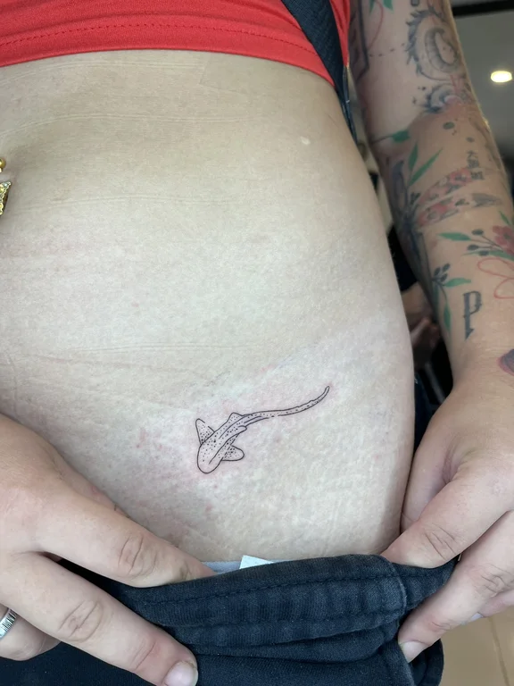 abstract fine line snake linework minimal bold line dotwork elegant tattoo Canggu Bali