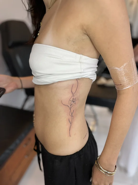 abstract fine line woman linework elegant bold line soft shading wave tattoo Canggu Bali