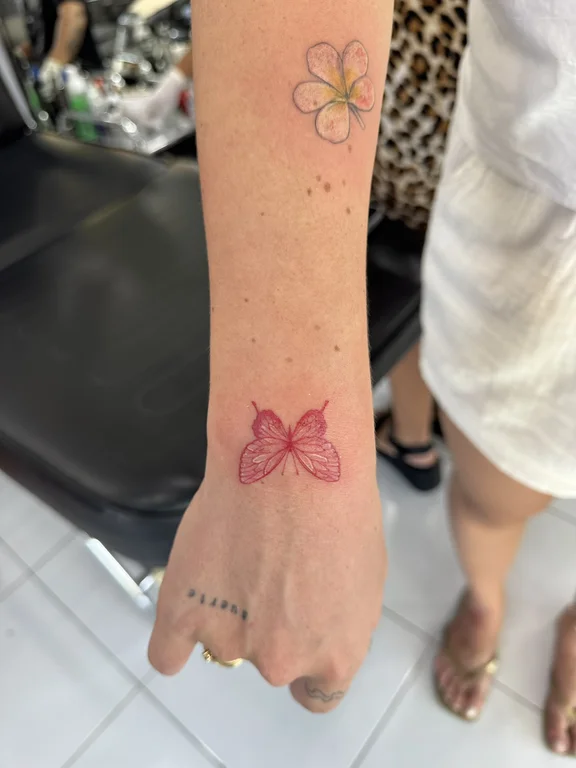 symbol minimalist butterfly fine line elegant soft shading dotwork colorful tattoo Canggu Bali