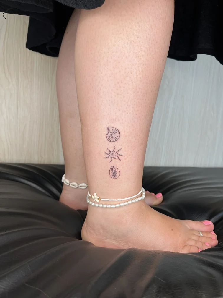 woman foot shell animal sea fine line linework line tattoo canggu bali