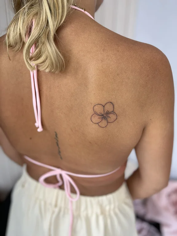 floral fine line lotus bold line elegant minimal peony linework tattoo Canggu Bali