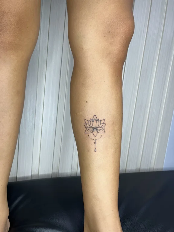 floral fine line lotus dotwork sun elegant linework soft shading tattoo Canggu Bali