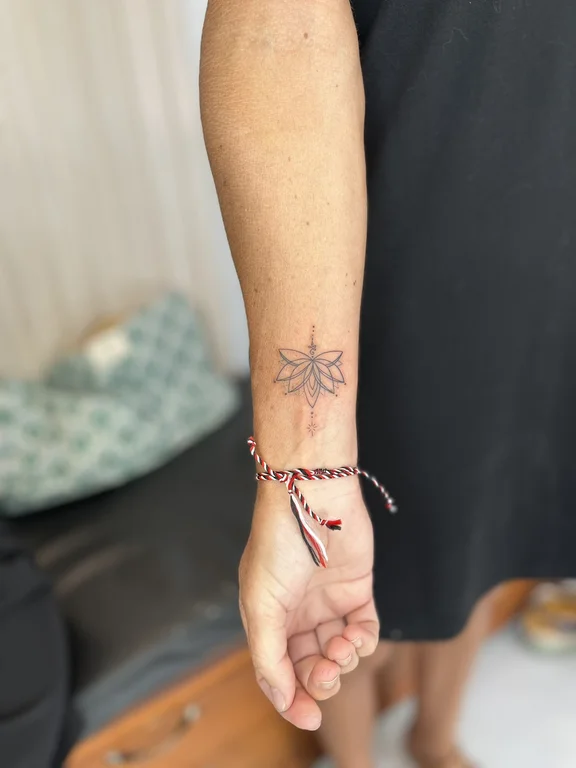 symbol traditional lotus fine line sun elegant soft shading minimal tattoo Canggu Bali