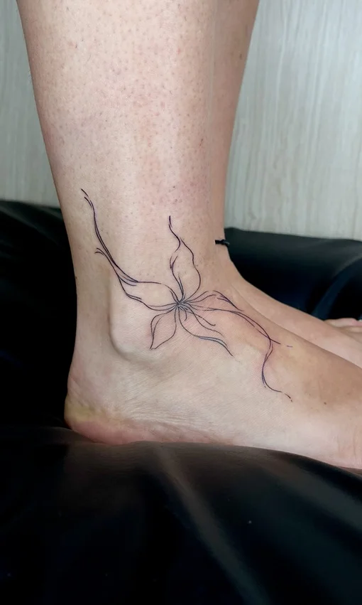 woman foot flower fine line fineline linework line tattoo canggu bali