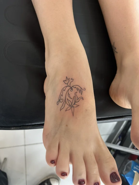 floral fine line woman linework elegant soft shading minimal flower tattoo Canggu Bali