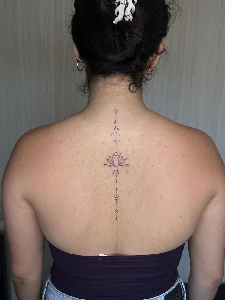 woman back geometric fine line fineline linework line black flower tattoo tattoo canggu bali