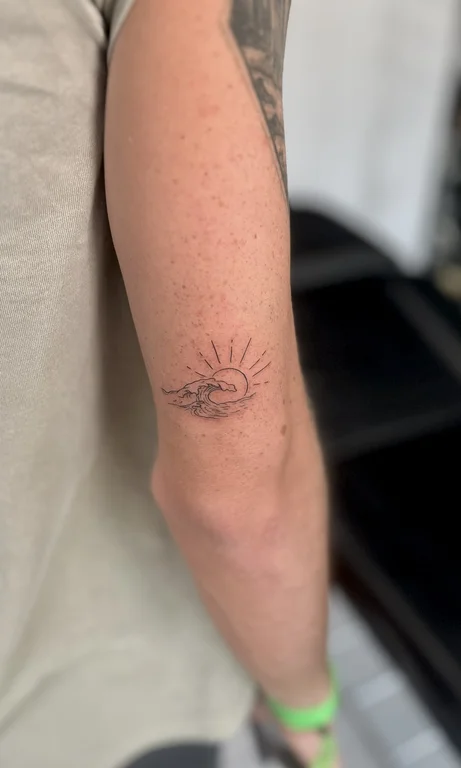 hand dotwork sun wave minimal linework tattoo canggu bali
