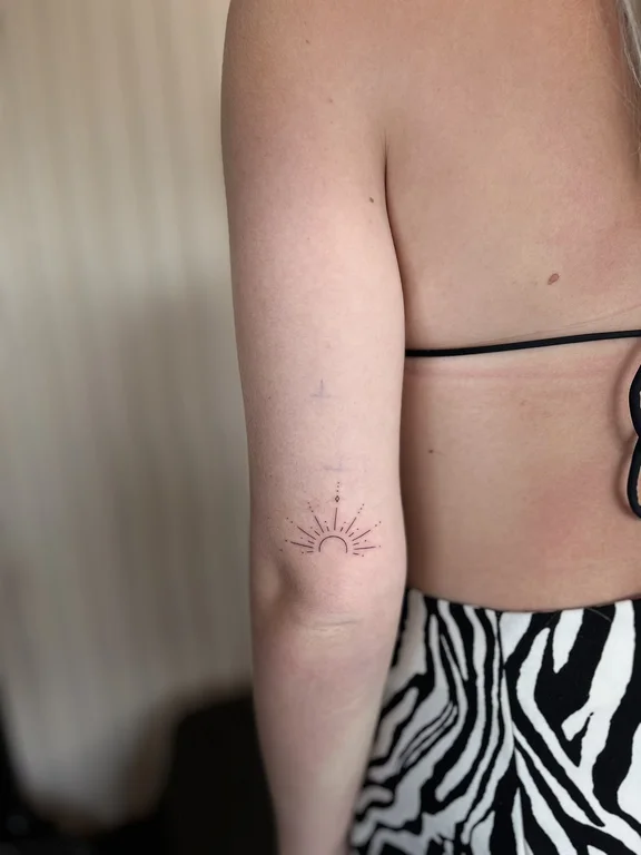 geometric fine line lotus dotwork sun minimal linework bold line tattoo Canggu Bali