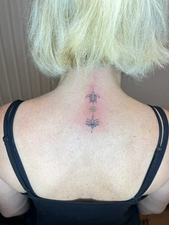 geometric blackwork woman fine line minimal dotwork spiritual linework tattoo Canggu Bali