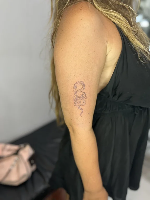 portrait fine line woman linework cloud snake wave elegant tattoo Canggu Bali