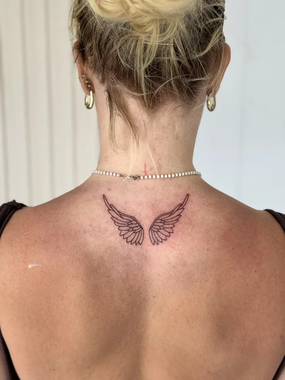 symbol fine line angel dotwork elegant butterfly soft shading spiritual tattoo Canggu Bali
