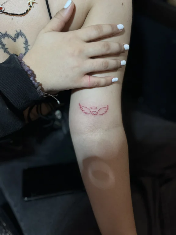 symbol fine line angel soft shading elegant minimal dotwork mystical tattoo Canggu Bali