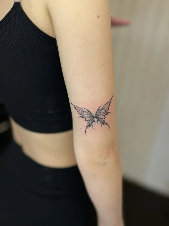 symbol blackwork butterfly black grey elegant minimal soft shading dotwork tattoo Canggu Bali