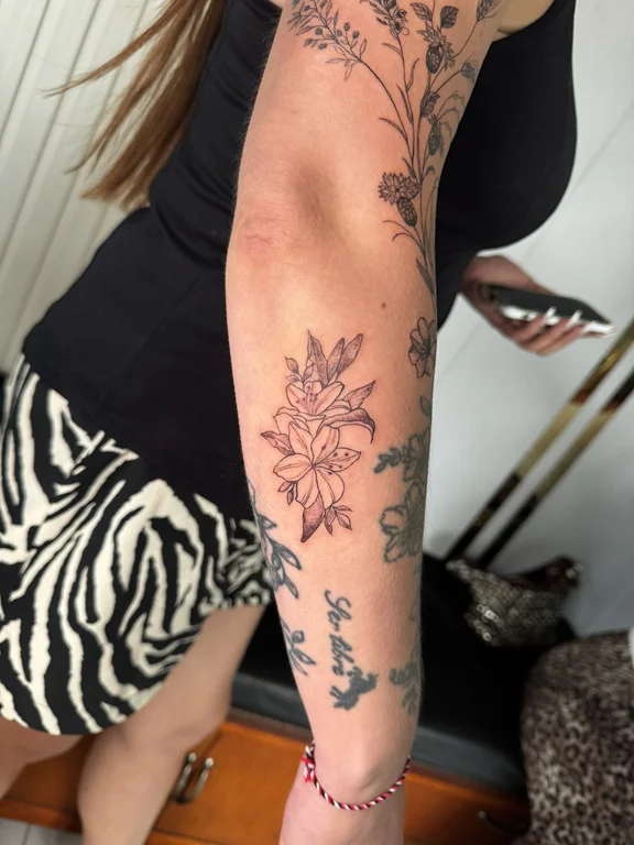 floral linework peony dotwork elegant soft shading mystical black grey tattoo Canggu Bali