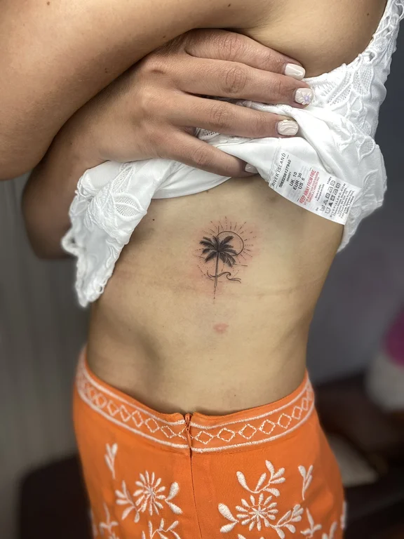 symbol traditional woman fine line sun leaf fire soft shading tattoo Canggu Bali