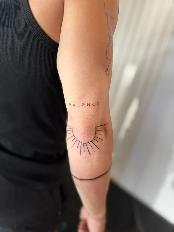 abstract minimalist eye fine line sun minimal elegant bold line tattoo Canggu Bali