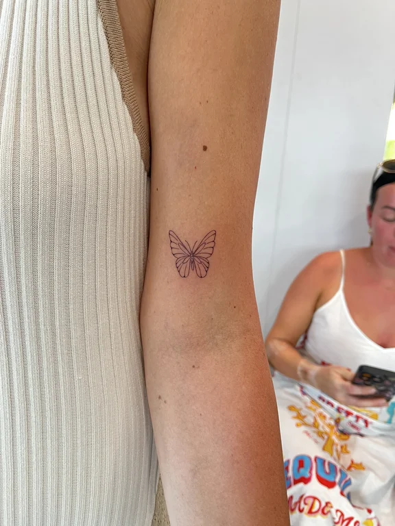 symbol minimalist butterfly dotwork elegant fine line linework soft shading tattoo Canggu Bali