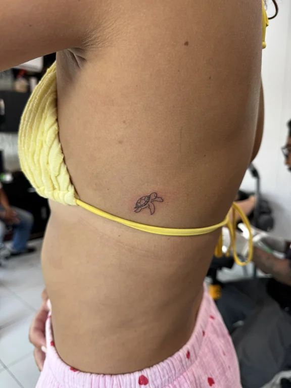 animal minimalist woman fine line wave thin line bold line sun tattoo Canggu Bali