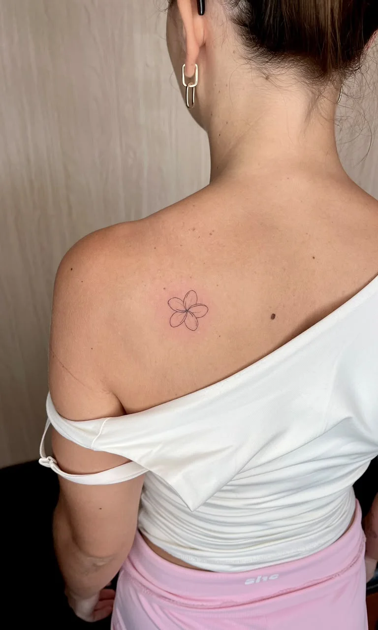 woman back small flower minimalist fine line line work line tattoo canggu bali