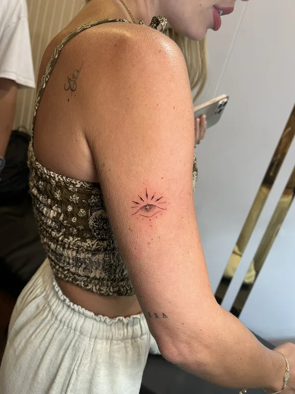 geometric minimalist woman fine line minimal sun elegant dotwork tattoo Canggu Bali