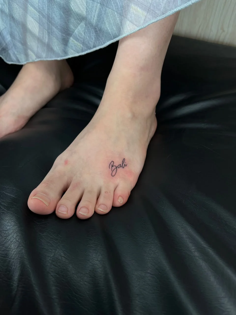 woman foot small lettering minimalist bali fine line line work line tattoo canggu bali