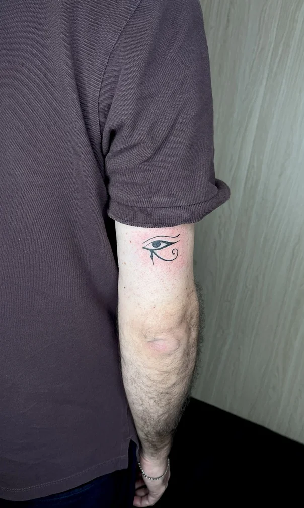 eye man hand minimalist mythology black fine line fineline linework tattoo tattoo canggu bali