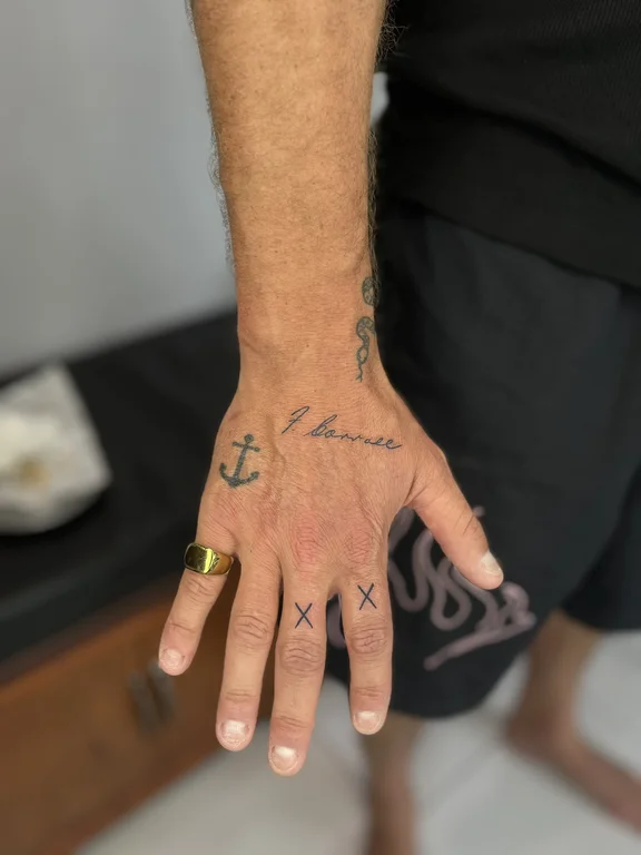 religious minimalist hand fine line wave bold line man spiritual tattoo Canggu Bali