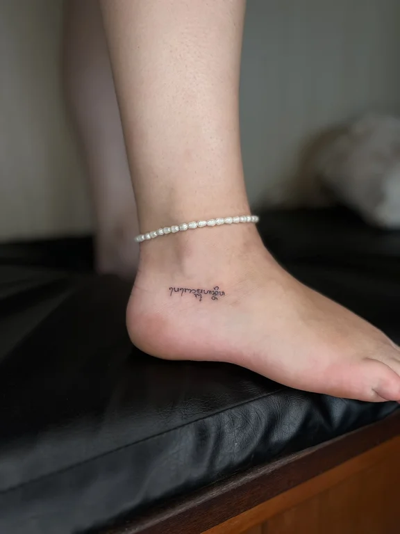 religious minimalist woman fine line minimal elegant thin line spiritual 1 tattoo Canggu Bali