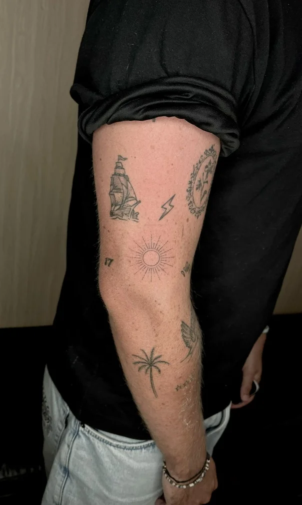 man hand sun symbol fine line linework line tattoo canggu bali