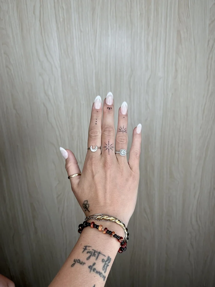 woman finger small symbol minimalist fine line linework line tattoo canggu bali
