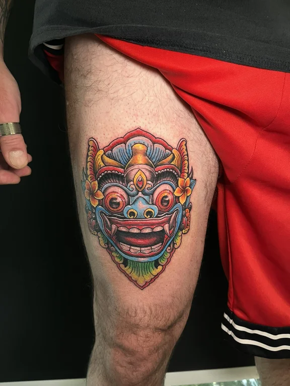 animal neo traditional mask colorful cloud demon deity face tattoo Canggu Bali