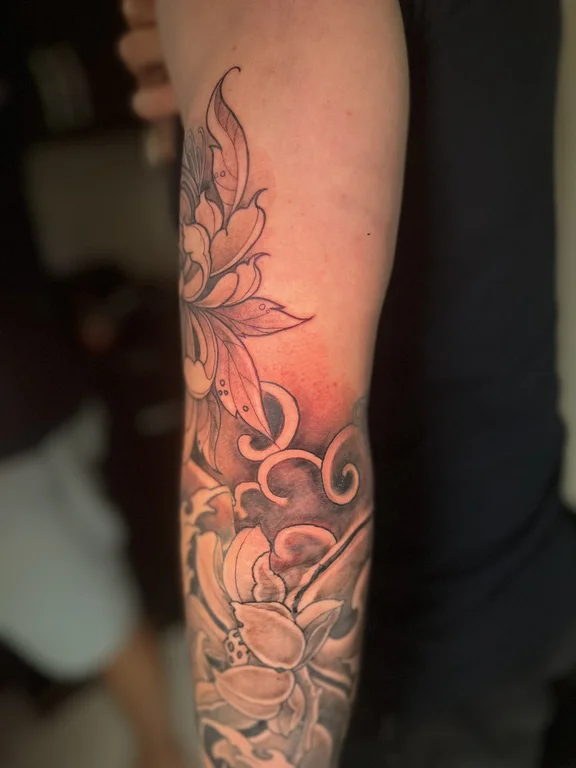 floral neo traditional lotus soft shading elegant dotwork linework heavy shading tattoo Canggu Bali