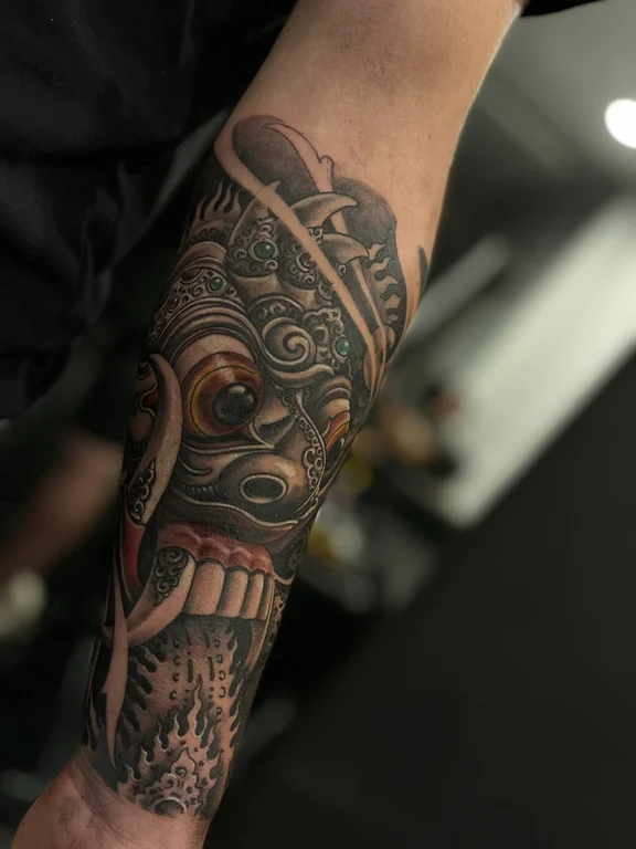 skull neo traditional mask heavy shading cloud black grey balinese pattern deity tattoo Canggu Bali