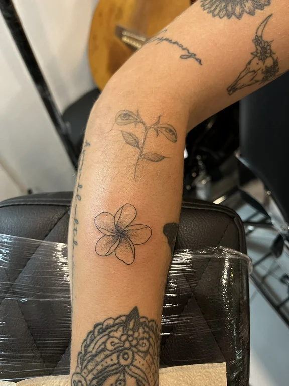 floral new school lotus black grey elegant soft shading linework fine line tattoo Canggu Bali