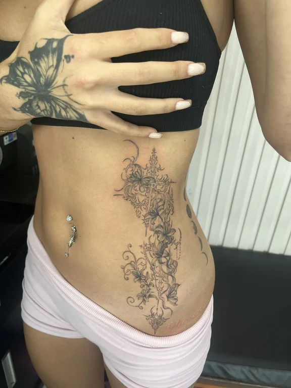 floral new school woman linework elegant dotwork fine line flower tattoo Canggu Bali
