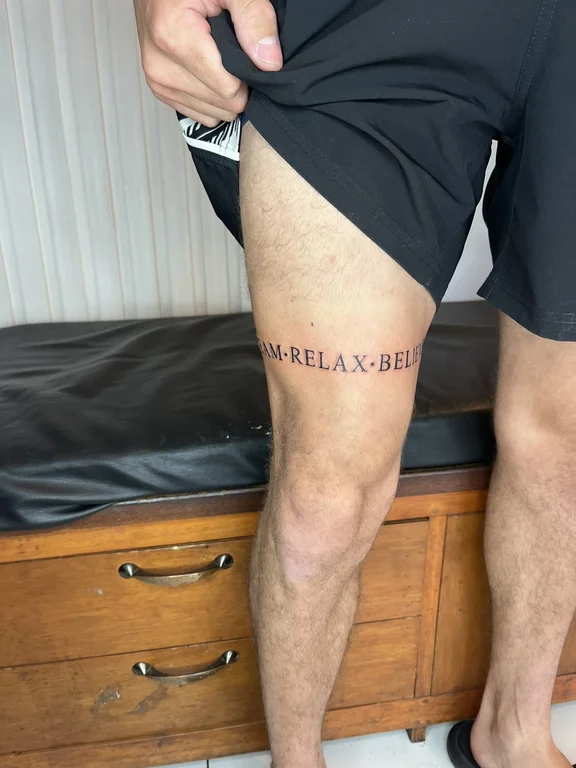 lettering new school man bold line minimal fine line spiritual black grey tattoo Canggu Bali
