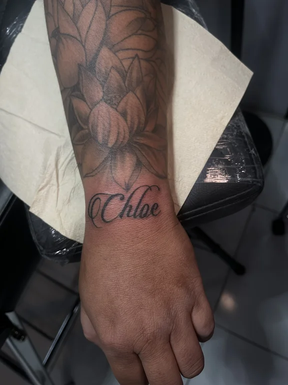 lettering new school rose black grey elegant soft shading fine line heavy shading tattoo Canggu Bali