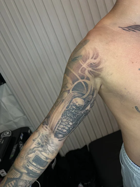 religious new school snake black grey cloud heavy shading sun soft shading tattoo Canggu Bali