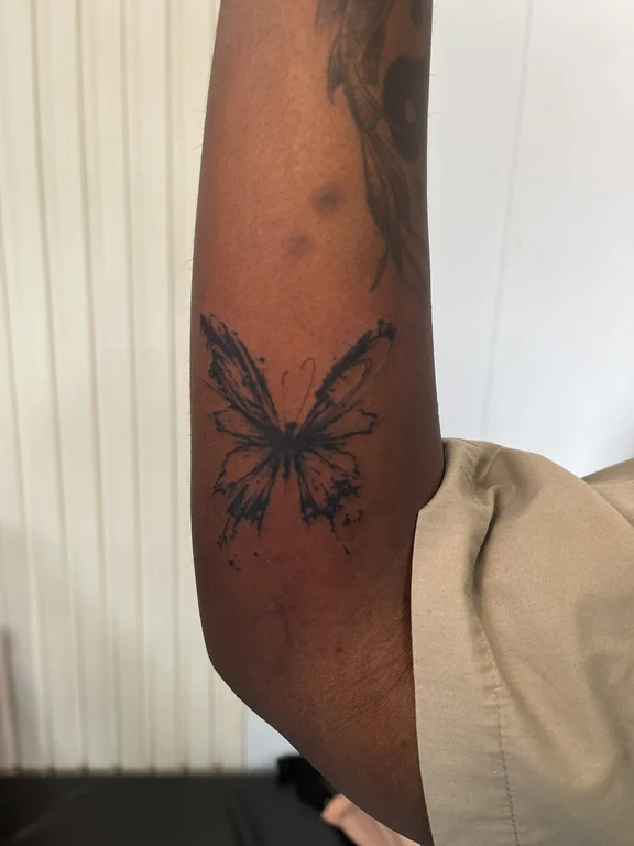 symbol new school butterfly black grey sun soft shading dotwork fine line tattoo Canggu Bali